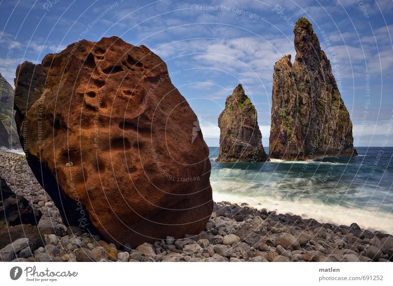 rock Environment Nature Landscape Water Sky Clouds Horizon Sunlight Spring Weather Beautiful weather Coast Beach Ocean Island Blue Brown Gray Stone Rock