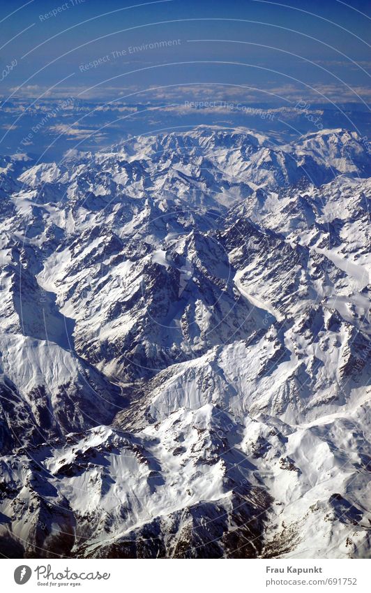 upstairs. Far-off places Snow Winter vacation Mountain Landscape Sky Clouds Horizon Beautiful weather Alps Peak Snowcapped peak Flying Gigantic Infinity Blue