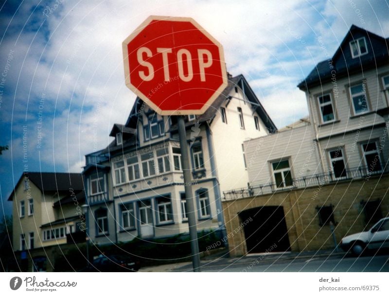 Detours increase local knowledge Stop Red Clouds Town House (Residential Structure) Window Blur go Signs and labeling Sky Americas river (not fig.) Door