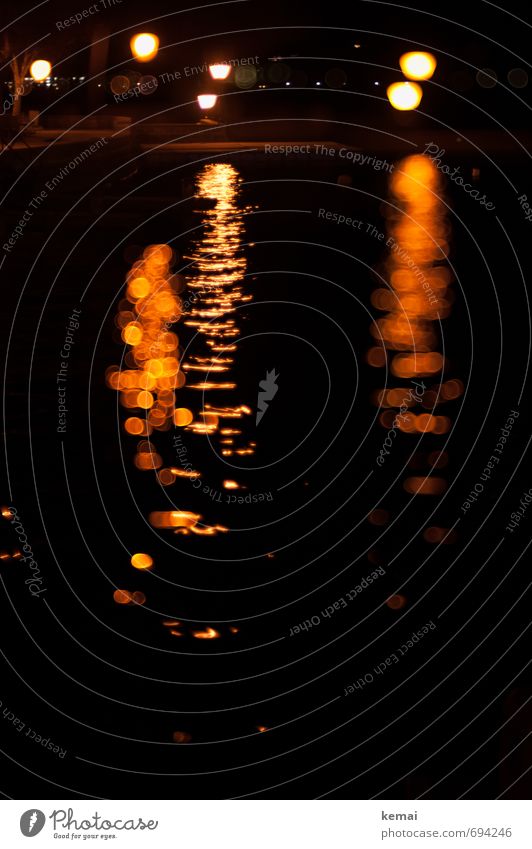 Lights in the dark Water Lake Surface of water Waves Dark Orange Black Calm Point of light Light (Natural Phenomenon) Street lighting Lamp Night shot Slumber