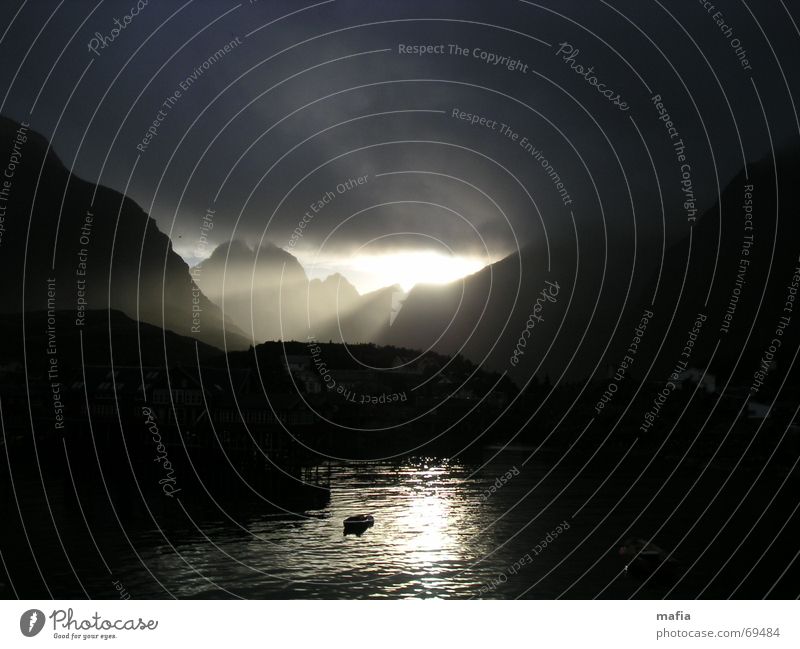 doom mood Dark Light and shadow Norway Ocean Lofotes Watercraft Apocalypse Threat Awareness Clouds Lighting Mountain Death Sun Landscape storm. Eyes