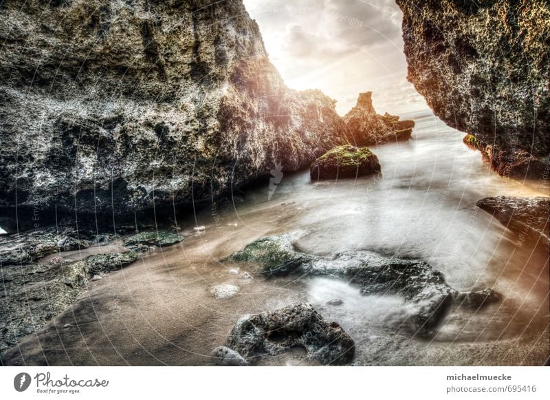 Rocks and water Beach Ocean Nature Landscape Sand Water Sun Coast Indonesia Asia Beautiful Strong Yellow Orange Silver Power Wanderlust Loneliness Moody Change