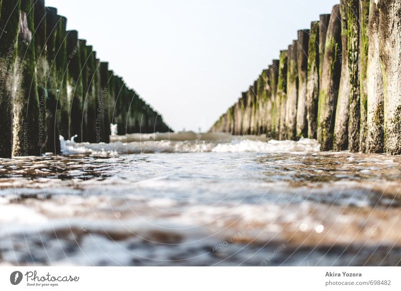 Breakwater II Water Sky Waves Coast Beach North Sea Touch Movement Fluid Wet Blue Brown Green Black White Protection Relaxation Nature Vacation & Travel