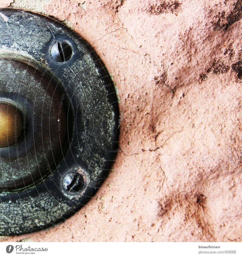 Caught in the rock Buttons Wall (barrier) Brass Sandstone Bell Partially visible Screw Stone Rock