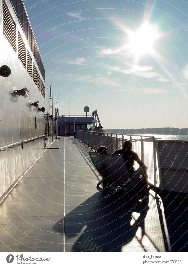 (Finn) Land in sight! Watercraft Ferry Back-light Dazzle Patch of light Deckchair Clouds Ocean Wall (building) Glittering Vacation & Travel White Black Mainland