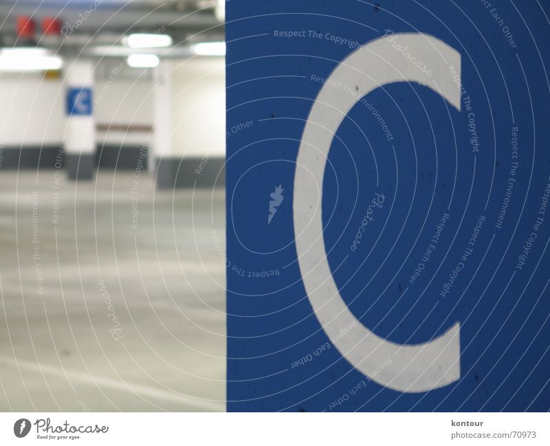 Deck C Parking level Column Deep Typography White Blur Empty Underground Blue letter ""c""