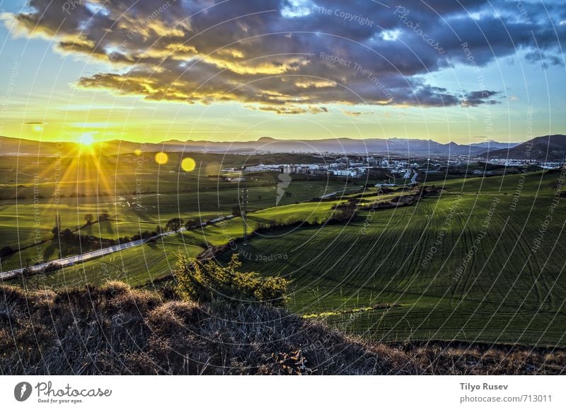 Beautiful sunset Nature Landscape Sky Clouds Meadow Town Natural Blue Yellow Green Sunset star Glow shine Ray Pamplona over fields Valley Spain Europe Navarra