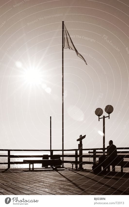 the eighth note aka. spot landing Jetty Flag Rod Lamp Lantern Portrait format Vertical Footbridge Plank Radiation Monochrome Dazzle Ocean Lake Binoculars