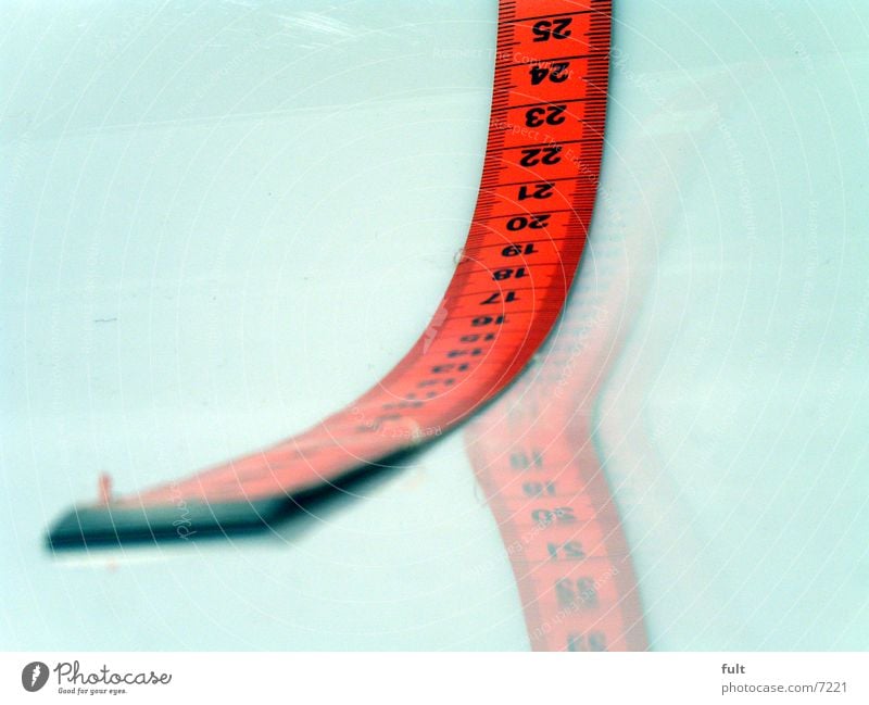 tape measure Tape measure Red Style Reflection Things White Digits and numbers Macro (Extreme close-up) Lie End Beginning Close-up Numbers