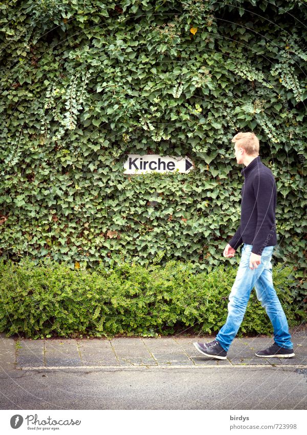 Young man turns his back on the church. symbolic image, leaving the church, disappointment about the church Religion and faith Church dislike Mistrust Abuse