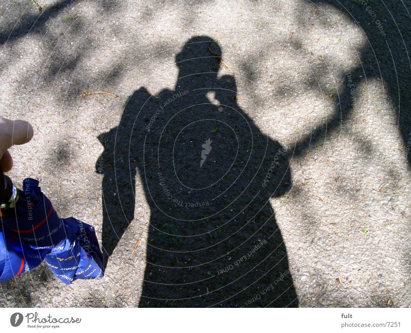 shadow man Man Umbrella Style Human being Tar Posture Photographic technology Shadow Blue Floor covering Nature Lanes & trails Structures and shapes