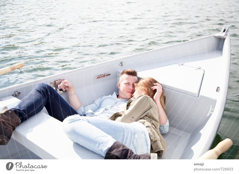 young couple on rowing boat on lake Masculine Feminine Young woman Youth (Young adults) Young man Couple 2 Human being 18 - 30 years Adults Water Spring