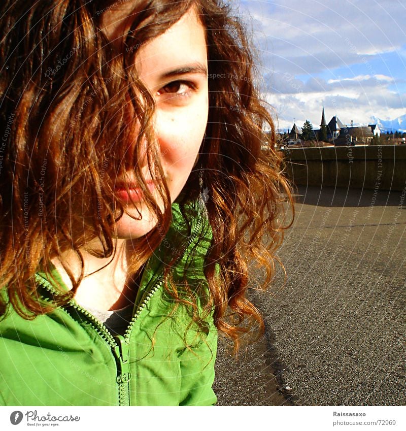 calm down... Asphalt Brunette Jacket Town Square Autumn woman outside Canton Bern Hair and hairstyles Wind Blue sky Autumnal