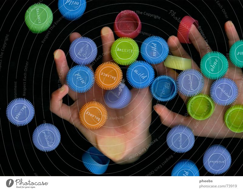 smarties? Hand Fingers Catch Dark Colour Advertising Minerals Mineral water Scanner Multicoloured