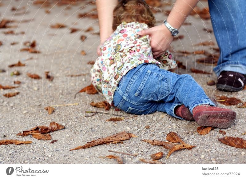 plumbed down Colour photo Exterior shot Day Full-length Rear view Child Legs Feet Pants Footwear Curl To fall Lift Floor covering