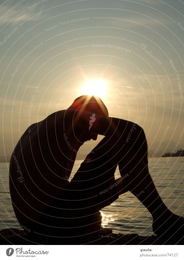 backlit man reading at the lakefront Back-light Sunset Lake Garda Book Reading Dusk Man Summer Italy Silhouette Water Evening corona lessons Exterior shot