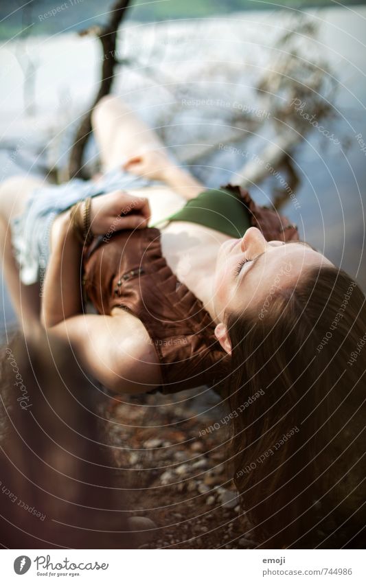 ulna Feminine Young woman Youth (Young adults) 1 Human being 18 - 30 years Adults Brunette Long-haired Lie Colour photo Exterior shot Day Shallow depth of field