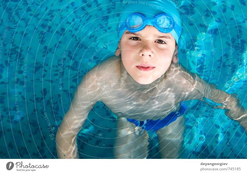 Little boy in swimming pool Joy Happy Leisure and hobbies Playing Vacation & Travel Summer Sports Swimming pool Child School Boy (child) Infancy Smiling