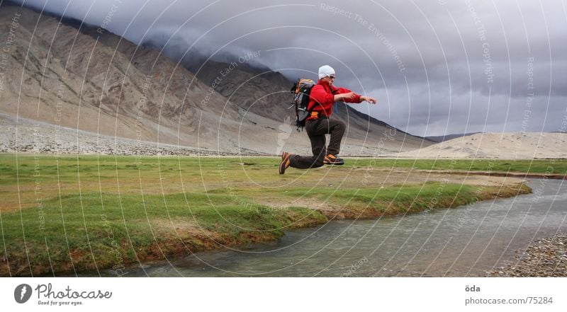 üüüpf Jump Far-off places Traverse Man Backpack Jump over Hop Brook River Water Hiking