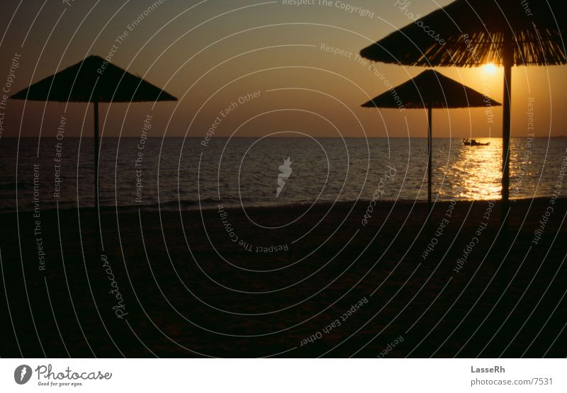 Boat in the sun Fisherman Greece Ocean Sunset Water