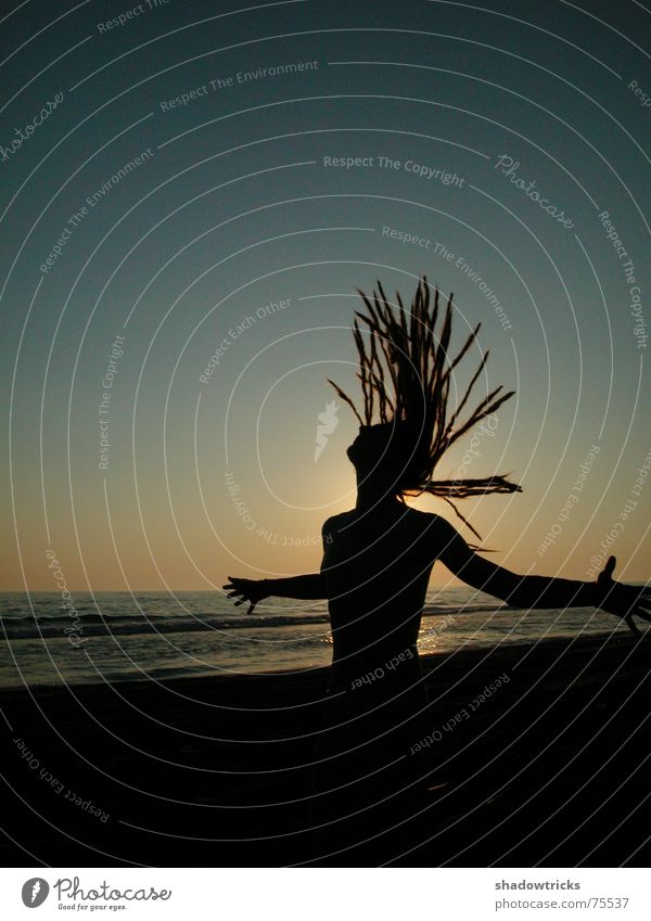 Take a deep breath! Ocean Dreadlocks Sunset Man Cyan Turquoise Yellow Light Beach Portrait photograph Outstretched Air Upper body Back-light Aperture Horizon