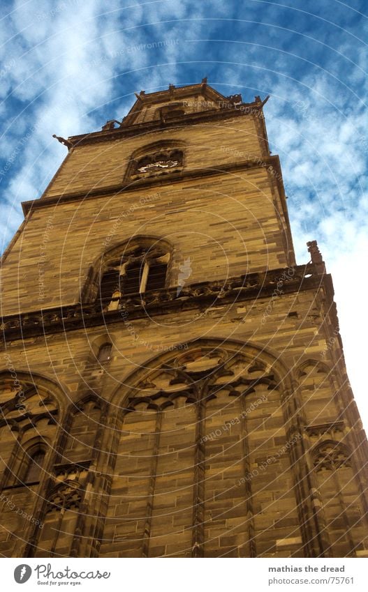 The Solitary Guardian Church spire Building Masonry Wall (barrier) Window Romance Clouds Religion and faith Deities Arch Worm's-eye view Under Sandstone Brown