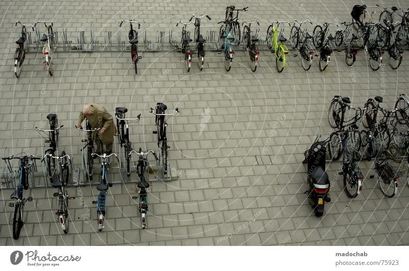 NO WACH?! Bicycle Bicycle lot Human being Life Parking Town Asphalt Gray Under Pedestrian Transport Gloomy Pattern Background picture Structures and shapes