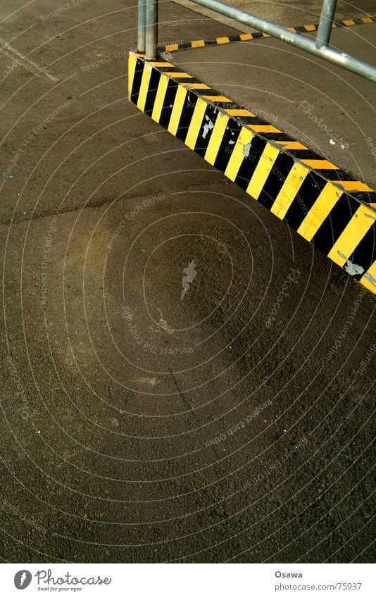 loading area Corner Striped Yellow Black Pavement Tar Asphalt Signs and labeling Street