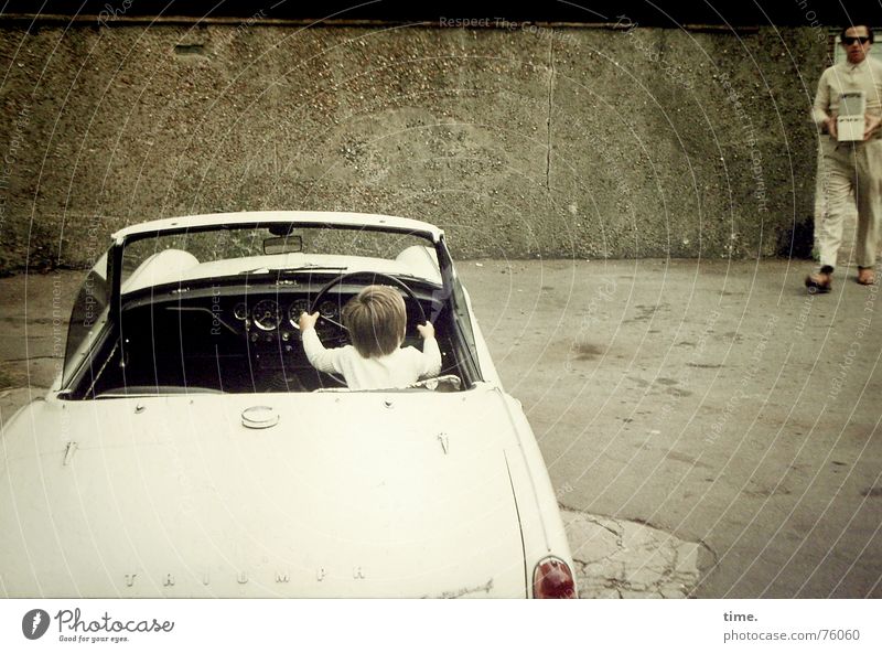 Unfinished Road Movie Colour photo Subdued colour Exterior shot Day Success Masculine Boy (child) Father Adults Car Convertible Enthusiasm Amazed Steering wheel