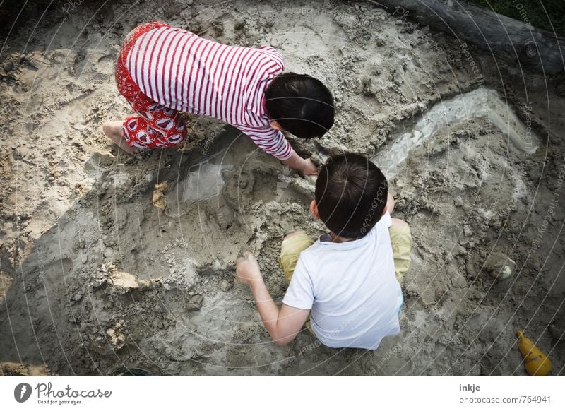 Two children playing in the sand Playing Children's game Vacation & Travel Summer vacation Beach Parenting Girl Boy (child) Brothers and sisters Sister