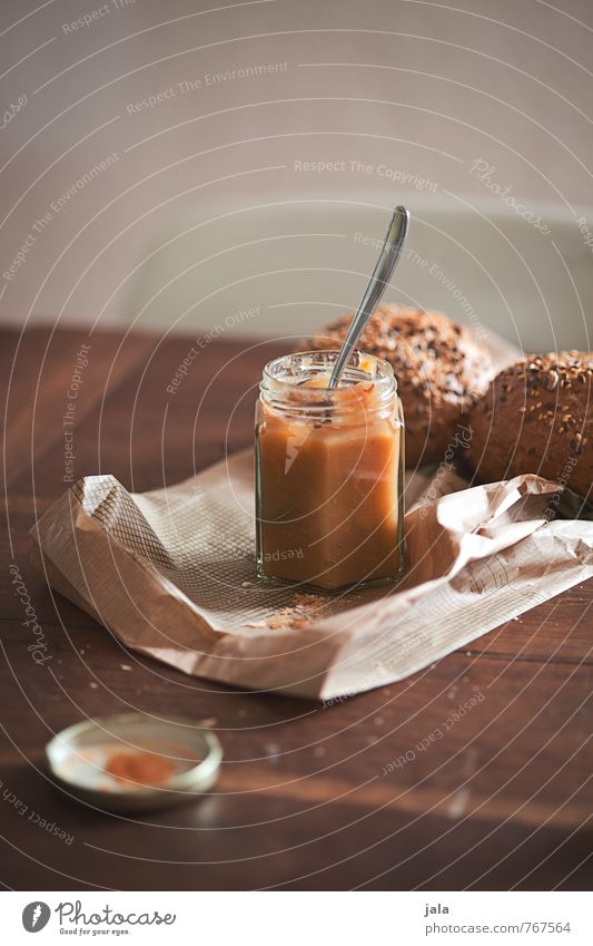 marmalade Roll Jam Jam jar Nutrition Breakfast Organic produce Vegetarian diet Spoon Paper bag Esthetic Friendliness Good Delicious Natural Wooden table