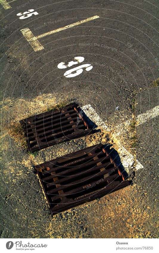 35, 36 Gully Parking lot Asphalt Pavement Parking area Traffic infrastructure Digits and numbers thirty-six thirty-five Street