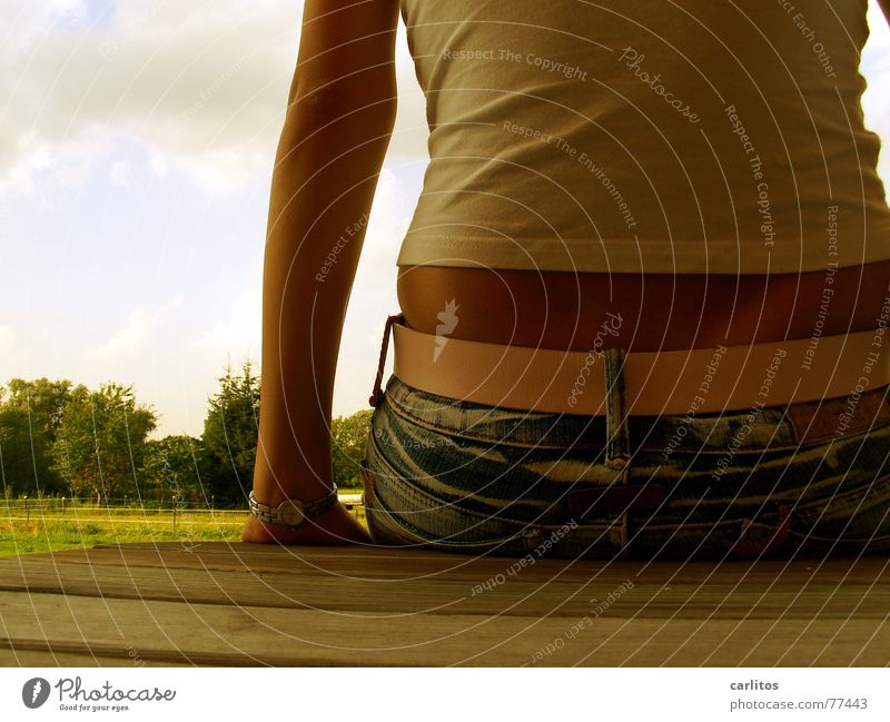 Young woman sitting on table Summer Break Showing one's bellybutton Woman Feminine Sit Back no tattoo Tattoo Human being Adults Youth (Young adults)