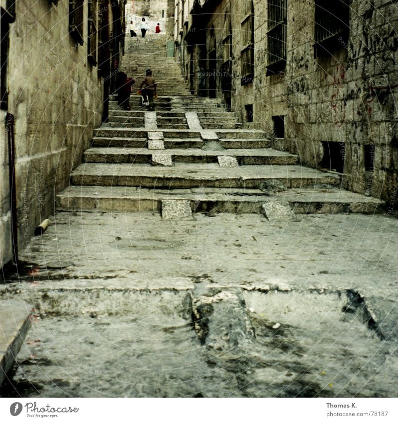 Jerusalem (or the calm before the storm 2000) Israel West Jerusalem Alley Child Wheelbarrow Window Grating Brick Grunge Stony Heavy Go up Dirty Street Old