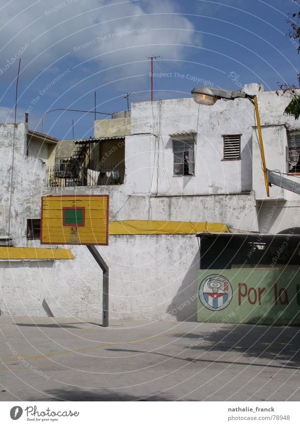 Basketball Playground in La Habana Havana Cuba Blue sky Derelict playground abandoned area cuban flag concrete