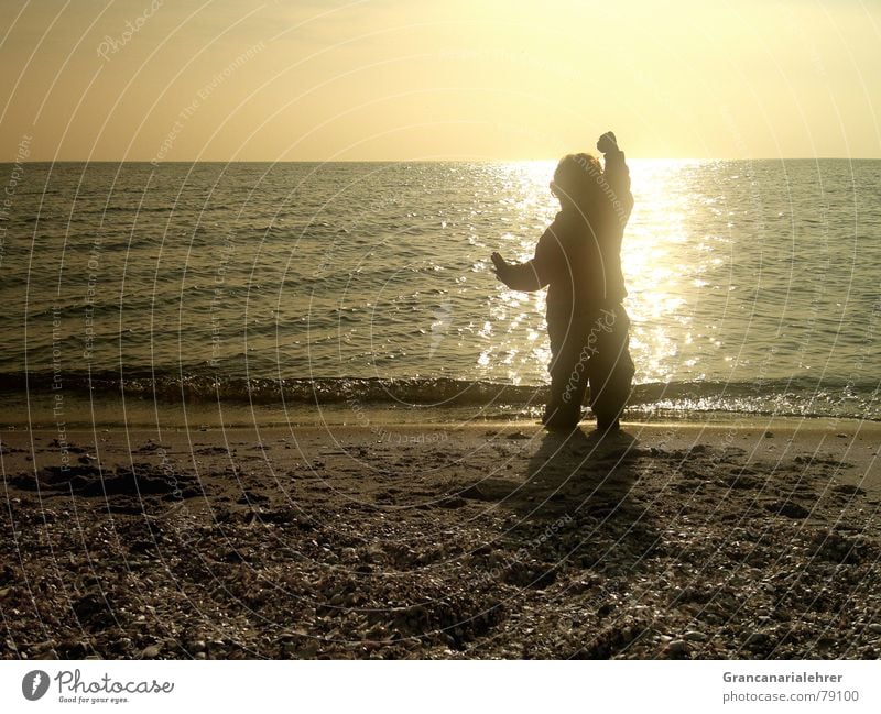 child's dream Ocean Beach Stony Child Black Shadow Girl Sunset Longing Loneliness Romance Playing Exterior shot Toddler Coast Calm Happy Boy (child) Water