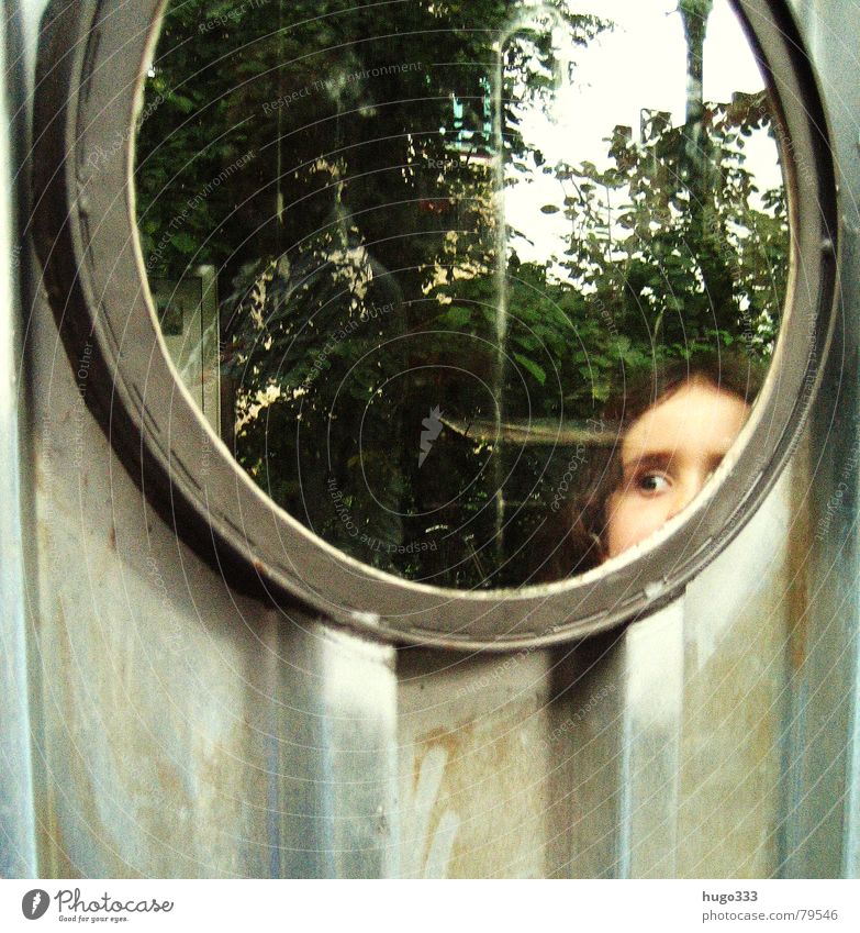 she's got the look Fleeting Brunette Child Window Corrugated sheet iron Wall (building) Curiosity Girl Round Porthole Reflection Looking Hollow Observe Dark