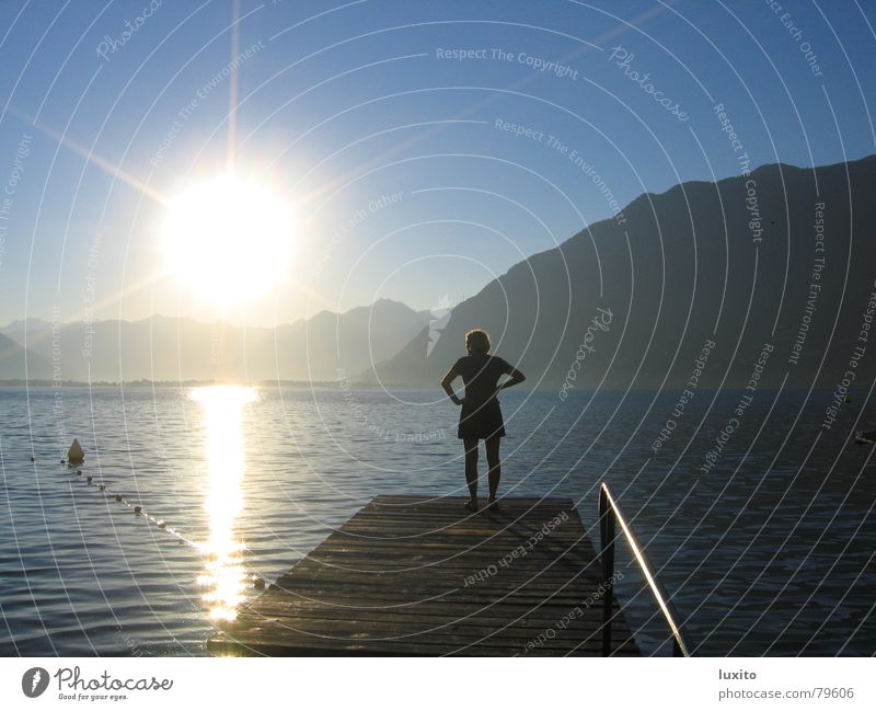 Enlightened Lake Woman Summer Longing Morning Sunrise Sky Nostalgia Clouds Loneliness Vacation & Travel Sunbathing Light Calm Beautiful Water Mountain Blue Dawn