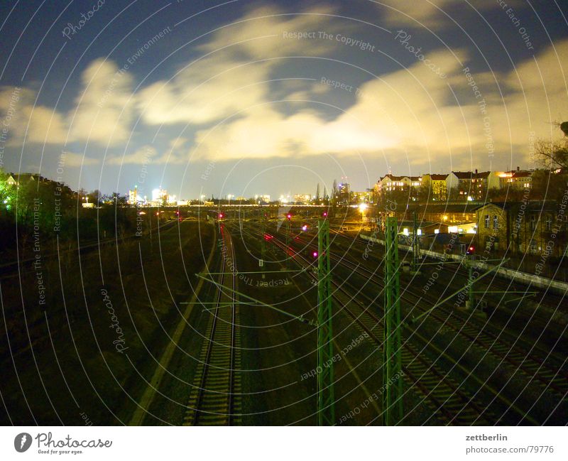 Berlin, at night Freight train Passenger train Logistics Berlin public transportation services Night Long exposure Clouds Railroad tracks Commuter trains Sky