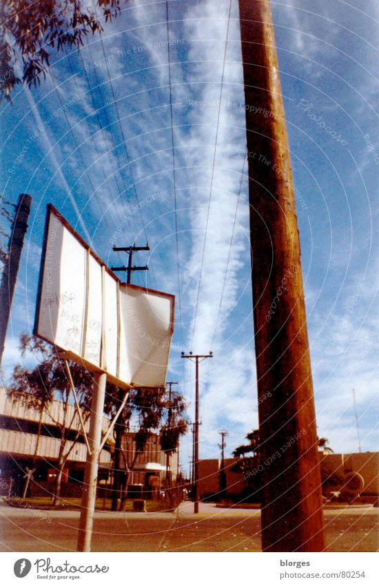 la frontera Border area Clouds Steep Signage Americas Mexico Sky Street sign border fence calexico mexicali Signs and labeling Blue USA borderline