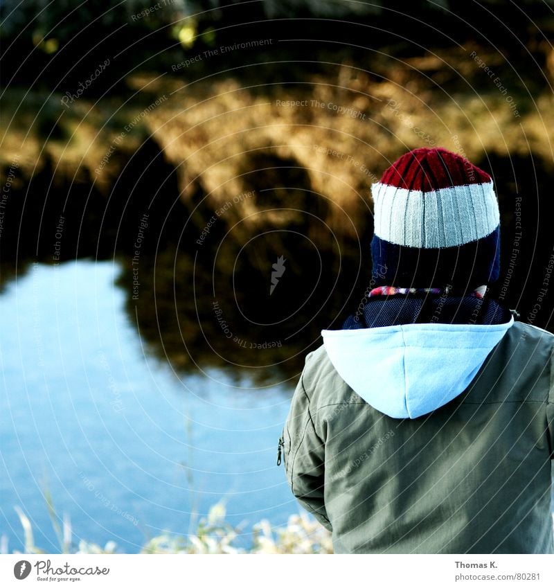 Time (or: banks hold the water) Brook Jacket Child Hooded (clothing) Grass River Cap Boy (child) Dike Levee Toddler Headwear Water Coast Loneliness Sadness