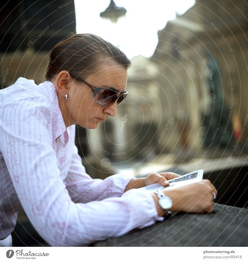 praha Colour photo Exterior shot Day Shallow depth of field Long shot Portrait photograph Looking away Lifestyle Happy Relaxation Reading Tourism City trip