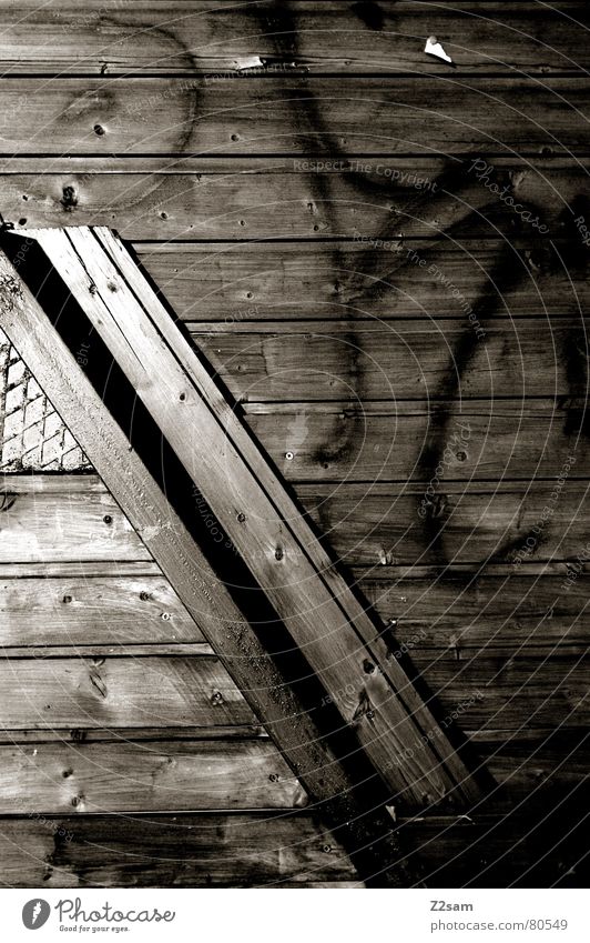 angles Diagonal Across Wood Window Grating Dark Glittering Detail tagged Corner Line Structures and shapes Screw Graffiti