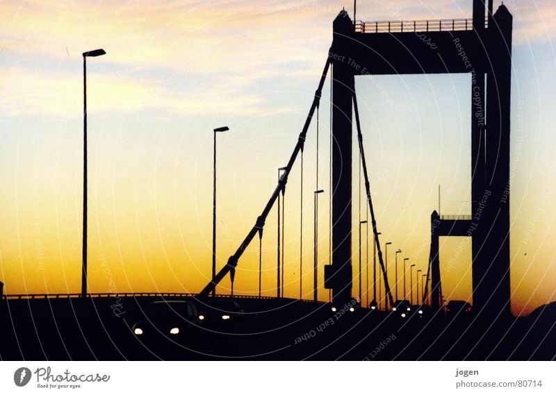 Homberg - Skyline Ruhrort North Rhine-Westphalia Motoring Back-light Strong Motionless Yellow Black Bridge pier Evening sun Duisburg Sunset Dusk Lamp post