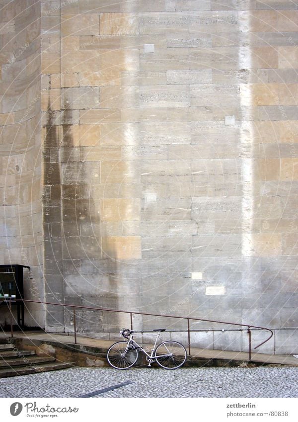 Waiting in front of the Volksbühne for mado Disability friendly Water mark Facade Sandstone Bicycle Damp Structures and shapes Handrail Stairs Cobblestones