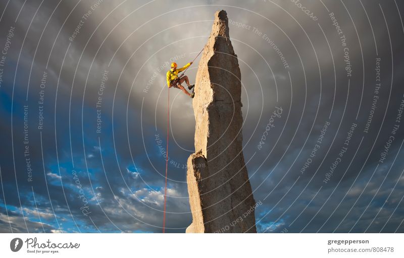 Climber tiptoes on the edge. Adventure Climbing Mountaineering Success Rope 1 Human being 30 - 45 years Adults Clouds Peak Self-confident Brave Determination