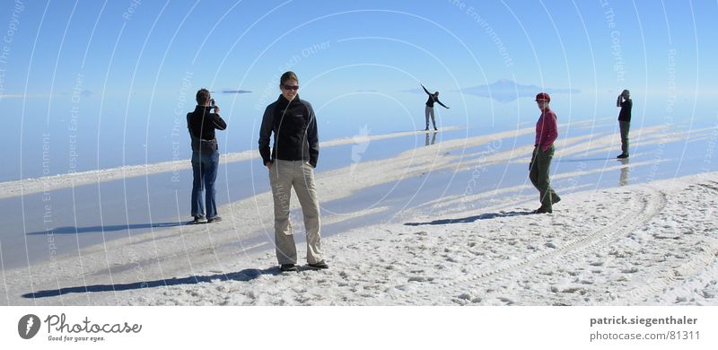 Scenes at the salt lake Salt  lake Take a photo Salar de Uyuni Lake Bolivia Dry Horizon Infinity Audience Mirror image Reflection White Calm South America Water