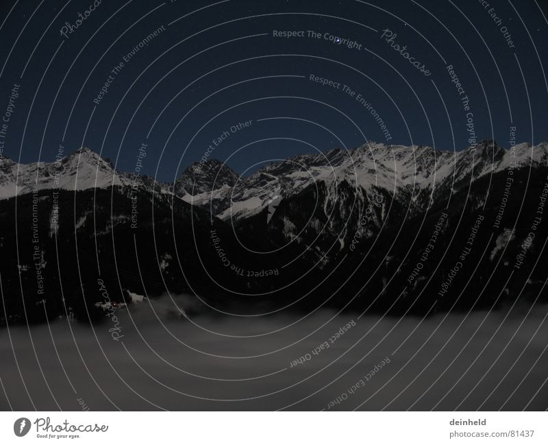 Sea of clouds with mountains Clouds Exposure Night Long exposure Winter blurred clouds Mountain Snow Fog Stars