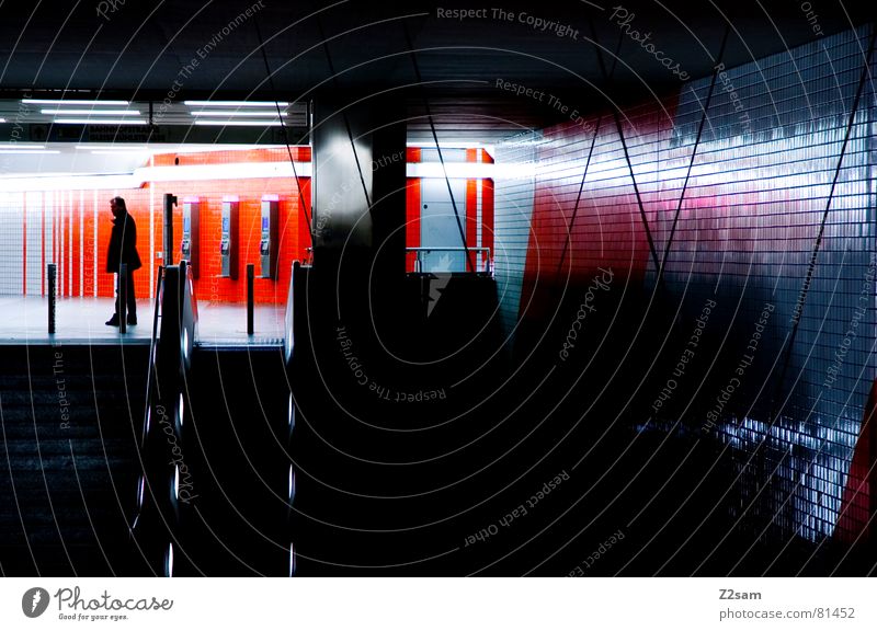 wait Stand Man Wall (building) Glittering Reflection Light Exposure Escalator Underground Human being Train station telphones Wait Colour Lamp Net Orange Blue