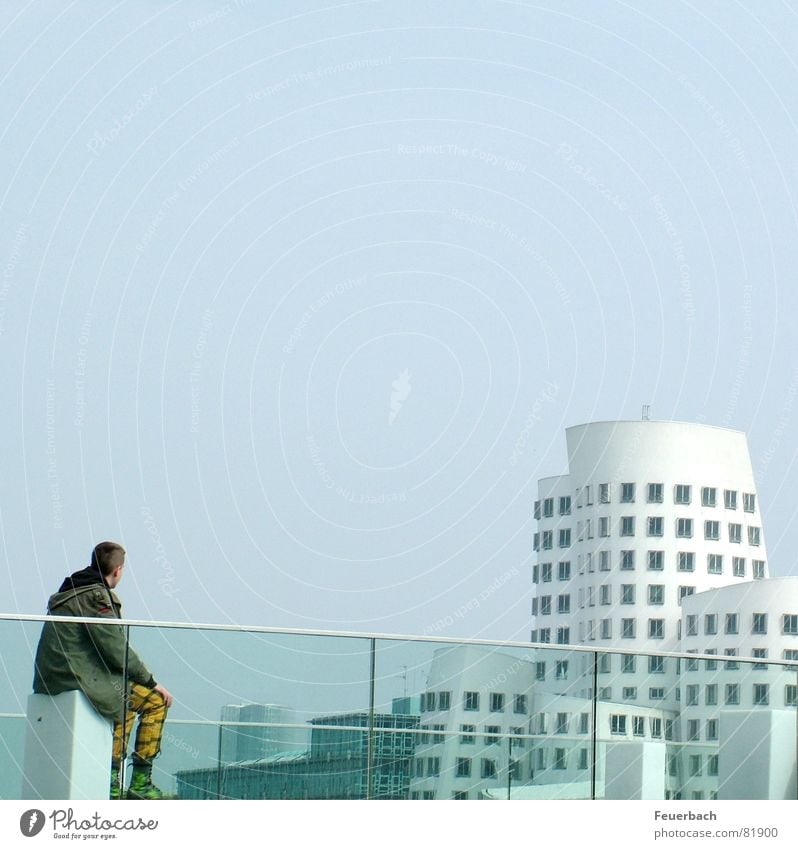 Punk looks at the modern world Colour photo Exterior shot Contrast Construction site Masculine Young man Youth (Young adults) 1 Human being Sky Cloudless sky